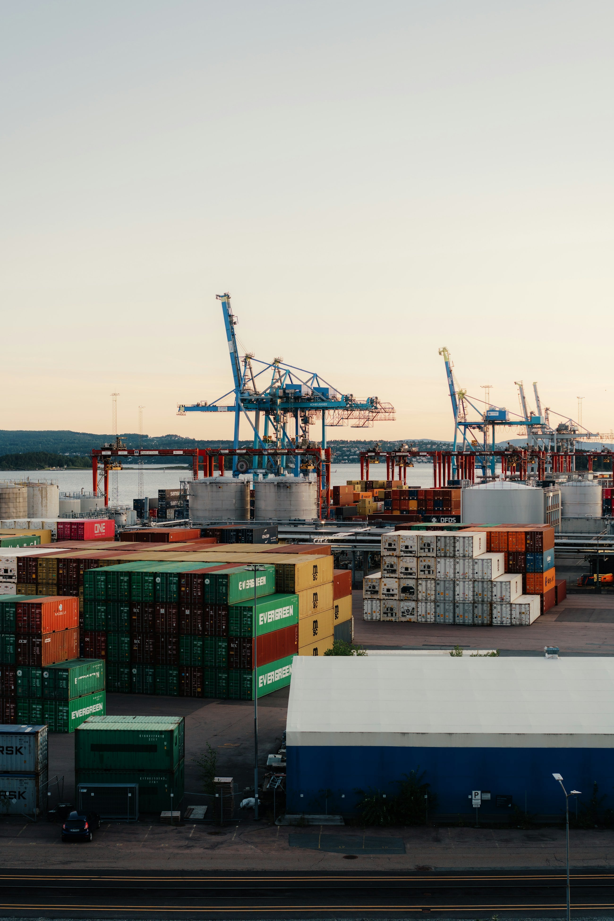Container stacks and ship-to-shore cranes at a container terminal